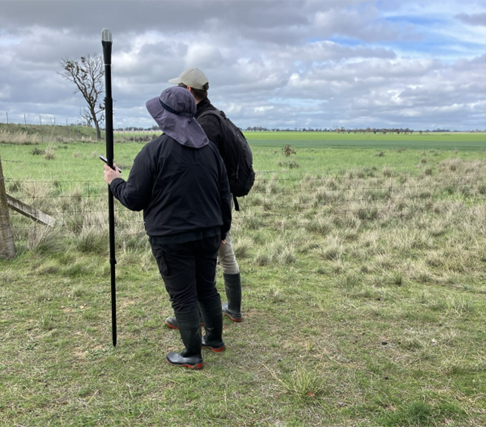 Two people conducting a historical heritage survey